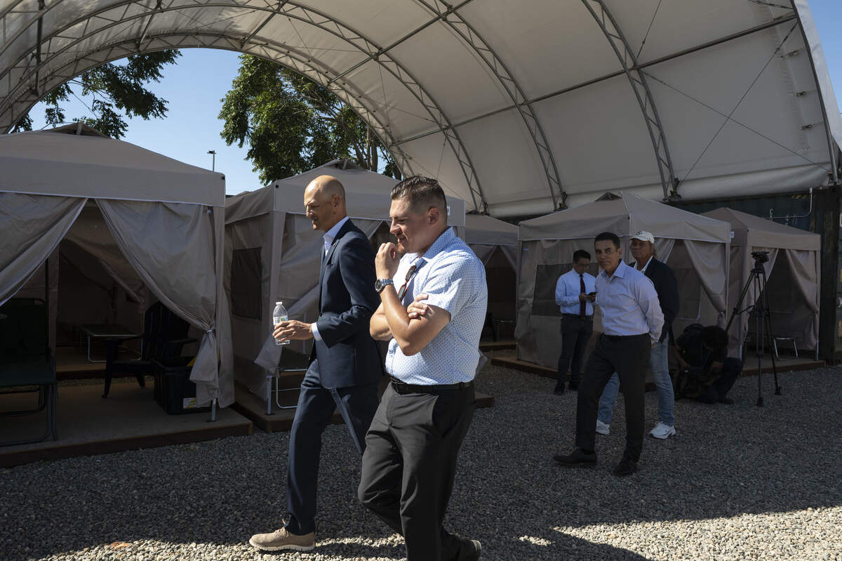 Sacramento Mayor Kevin McCarty, left, tours the new City of Sacramento Sequoia Safe Camping site in Sacramento on Tuesday, June 23, 2026.
